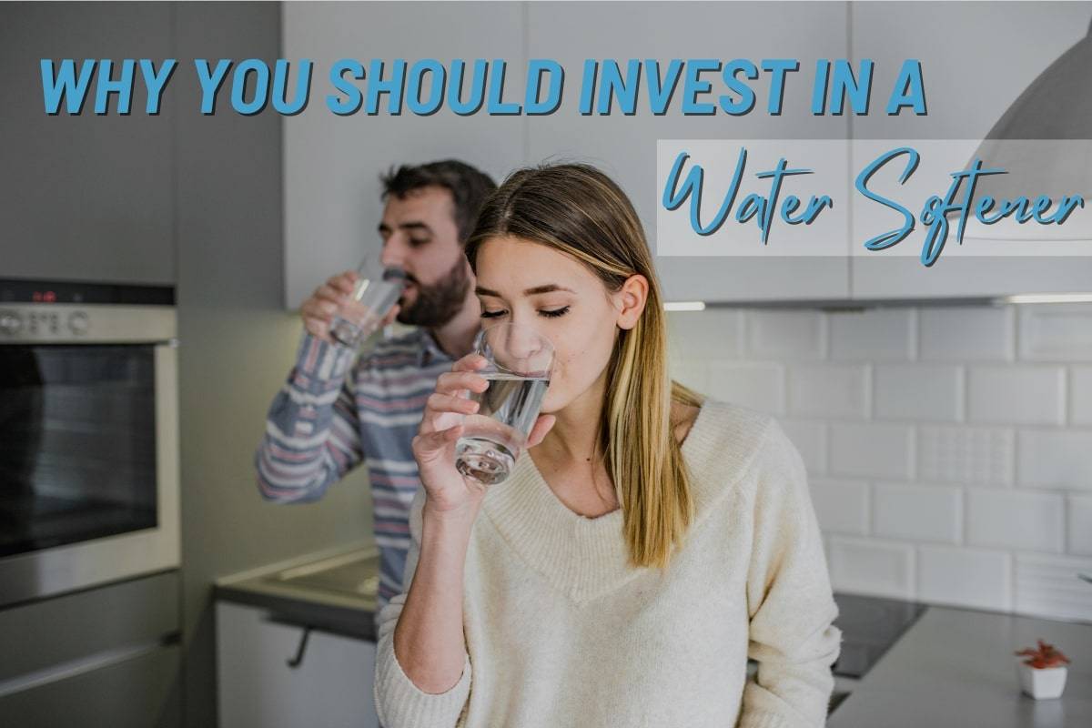 A man and a woman drinking soft water from water softener